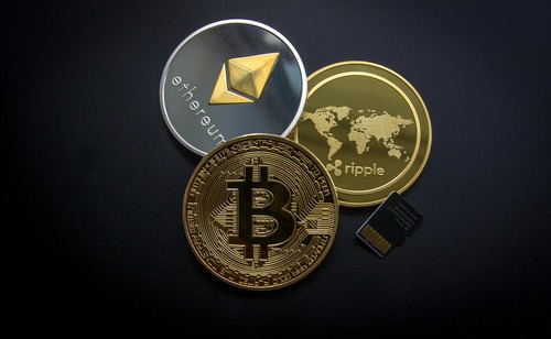 Ethereum (ETH), Bitcoin (BTC) and Ripple (XRP) physical cryptocurrency coins